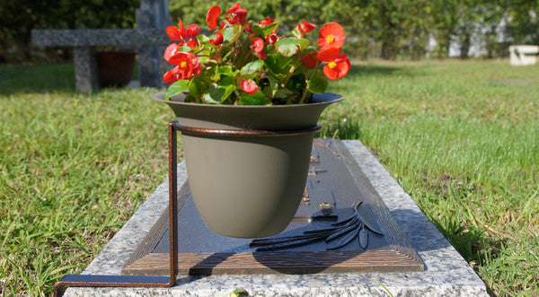 Durable and trouble-free.
Monumate holders are very durable. Made of heavy metal and their powder-coated paint finish ensures they will retain their attractive appearance for years to come.