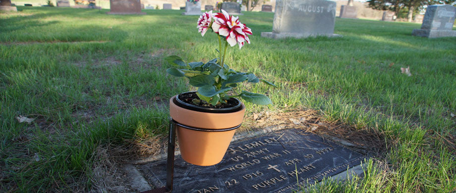 Meets cemetery requirements.
Many cemeteries no longer allow people to leave flowers around the gravestone unless they are out of the way for the caretakers. Monumate holders and vases keep memorial flowers safely off the ground, so cemetery caretakers need not remove them for mowing and maintenance.
